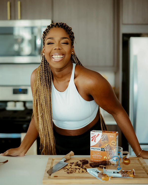 Hayet Rida smiling in a kitchen with Special K bars